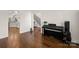 Inviting living area boasts gleaming hardwood floors and offers seamless access to the kitchen at 174 Bellingshire Dr, Mt Ulla, NC 28125