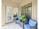 Cozy outdoor patio area with comfortable seating and views into the main bedroom at 174 Bellingshire Dr, Mt Ulla, NC 28125