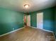 Bedroom with a view into an attached bathroom and a spacious closet at 1824 Maribel Ave, Charlotte, NC 28216