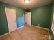 Bedroom featuring two closets, and access to an adjacent room at 1824 Maribel Ave, Charlotte, NC 28216