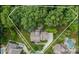 Aerial view of the property showcasing the home, expansive lot, mature trees, and pool at 2004 Viscount Dr, Matthews, NC 28104