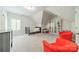 A bonus room is carpeted with bright colored chairs for relaxation or Gathering time at 2004 Viscount Dr, Matthews, NC 28104