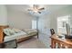 A neutral bedroom featuring carpeted floors, ceiling fan, and an adjoining bathroom offers modern comfort at 2004 Viscount Dr, Matthews, NC 28104