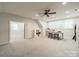 Bright bonus room featuring neutral walls, plush carpet, ceiling fan and craft area at 2004 Viscount Dr, Matthews, NC 28104