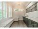 Hallway with bench seating, storage cabinets, quartz countertops, and natural lighting at 2004 Viscount Dr, Matthews, NC 28104