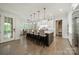Modern kitchen with large island, pendant lighting, stainless steel appliances, and hardwood floors at 2004 Viscount Dr, Matthews, NC 28104