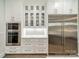 A modern kitchen with stainless steel appliances, white cabinets, and gold hardware exudes sophistication at 2004 Viscount Dr, Matthews, NC 28104
