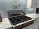Close up of modern kitchen featuring pot filler, stainless steel appliances and quartz countertops at 2004 Viscount Dr, Matthews, NC 28104