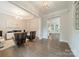 Open living room features hardwood floors, neutral paint, decorative lighting, and views to the backyard at 2004 Viscount Dr, Matthews, NC 28104