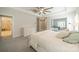 Bright main bedroom with a large bed, storage, and comfortable seating area at 2004 Viscount Dr, Matthews, NC 28104