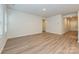 Neutral living area with light-colored walls and floors and access to multiple rooms at 2142 Sunflower Cir, Newton, NC 28658