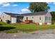 Large, level backyard featuring a wooden deck with a built-in hot tub at 24007 Old Aquadale Rd, Albemarle, NC 28001