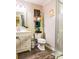 Cozy bathroom featuring a vanity with drawers, a mirror, decor and a walk-in shower at 24007 Old Aquadale Rd, Albemarle, NC 28001