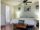 Comfortable bedroom featuring wood floors, ceiling fan, and en-suite bathroom with walk-in shower at 24007 Old Aquadale Rd, Albemarle, NC 28001
