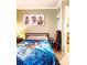 Comfortable bedroom with carpet, a mounted picture, and a view into a connected sitting room at 24007 Old Aquadale Rd, Albemarle, NC 28001