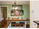 Eat-in kitchen design with dining table with bench seating and stylish decor at 24007 Old Aquadale Rd, Albemarle, NC 28001