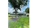 Charming ranch-style home with a large front yard and mature tree providing shade at 24007 Old Aquadale Rd, Albemarle, NC 28001