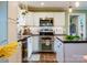 Updated kitchen features stainless appliances, granite counters, and a butcher block island at 24007 Old Aquadale Rd, Albemarle, NC 28001