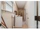 Laundry room with a washer and shelves for storage at 2500 Kendrick Dr, Charlotte, NC 28214