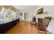 Open concept living room with hardwood floors, fireplace, and abundant natural light at 2500 Kendrick Dr, Charlotte, NC 28214
