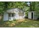 Exterior view of storage shed with awning, offering additional outdoor storage and utility at 2500 Kendrick Dr, Charlotte, NC 28214
