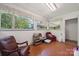 Sunroom sitting area filled with natural light from multiple windows at 2500 Kendrick Dr, Charlotte, NC 28214