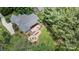 Expansive aerial view of this home featuring an outdoor kitchen, fire pit area and beautiful landscaping at 2590 Berne Ln, Sherrills Ford, NC 28673