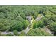 Beautiful home nestled in a lush forest, with a private driveway and meticulously maintained landscaping at 2590 Berne Ln, Sherrills Ford, NC 28673