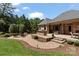 Beautiful backyard featuring an outdoor kitchen, covered patio and an outdoor fireplace with comfortable seating at 2590 Berne Ln, Sherrills Ford, NC 28673