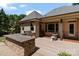Backyard patio with granite countertop grilling area and outdoor dining space, blending luxury with functionality at 2590 Berne Ln, Sherrills Ford, NC 28673