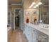 Elegant bathroom with double sinks, vanity, walk-in shower, and a separate soaking tub at 2590 Berne Ln, Sherrills Ford, NC 28673