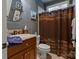 Bathroom featuring vanity with granite countertop and decorative fixtures plus shower with curtain at 2590 Berne Ln, Sherrills Ford, NC 28673