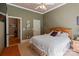 Comfortable bedroom featuring a ceiling fan, natural light, neutral colors, and wood furniture at 2590 Berne Ln, Sherrills Ford, NC 28673