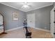 Bedroom featuring a ceiling fan, painting on the wall, double doors, and a total gym work out machine at 2590 Berne Ln, Sherrills Ford, NC 28673