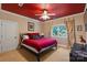 Bedroom featuring a ceiling fan, natural light, and red accents at 2590 Berne Ln, Sherrills Ford, NC 28673