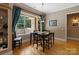 Inviting dining room featuring hardwood floors, a chandelier, and a view of the outdoor patio at 2590 Berne Ln, Sherrills Ford, NC 28673