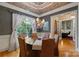 Formal dining room showcasing a statement chandelier, large window, and sophisticated decor at 2590 Berne Ln, Sherrills Ford, NC 28673