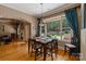 Bright dining room with hardwood floors and natural light from the large window overlooking the backyard at 2590 Berne Ln, Sherrills Ford, NC 28673