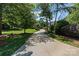 Long private driveway leading to a beautiful home surrounded by mature trees and greenery at 2590 Berne Ln, Sherrills Ford, NC 28673