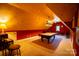 An expansive game room featuring a billiards table, piano, and unique ceiling design with warm lighting at 2590 Berne Ln, Sherrills Ford, NC 28673