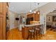Charming kitchen with stainless steel appliances, wood cabinets, and a granite countertop breakfast bar at 2590 Berne Ln, Sherrills Ford, NC 28673