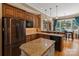 Spacious kitchen with stainless steel appliances, granite countertops, and convenient center island with seating at 2590 Berne Ln, Sherrills Ford, NC 28673