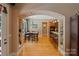 Open-concept living space with hardwood floors and view into dining area and kitchen at 2590 Berne Ln, Sherrills Ford, NC 28673