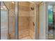 Luxurious tiled shower featuring glass door and decorative tilework at 2590 Berne Ln, Sherrills Ford, NC 28673
