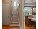 Inviting staircase leads to the upper level, adjacent to the dining room with decorative chandelier at 2590 Berne Ln, Sherrills Ford, NC 28673