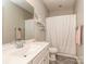 Bathroom with white vanity, grey tile flooring, white shower curtain, and modern fixtures at 314 Candella Dr, Matthews, NC 28104