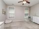 Spacious bedroom with beanbag chair, hanging chair, and dresser, illuminated by natural light at 314 Candella Dr, Matthews, NC 28104