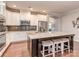 Beautiful kitchen featuring an island with seating, granite countertops, and white cabinetry at 314 Candella Dr, Matthews, NC 28104