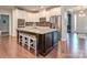 Elegant kitchen with a large island, granite countertops, and stainless steel appliances at 314 Candella Dr, Matthews, NC 28104