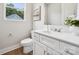 Modern bathroom with white vanity, toilet, and stylish decor at 384 Speedway Pl, Concord, NC 28027